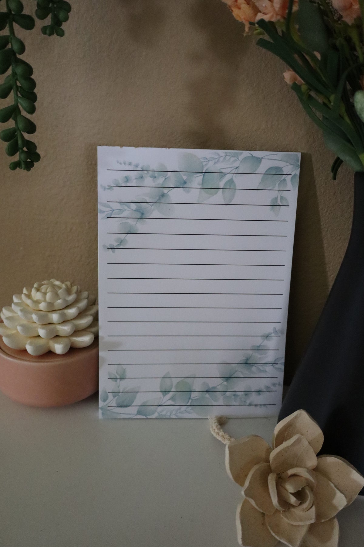 Close-up of eucalyptus watercolor lined notepad showing botanical print detail