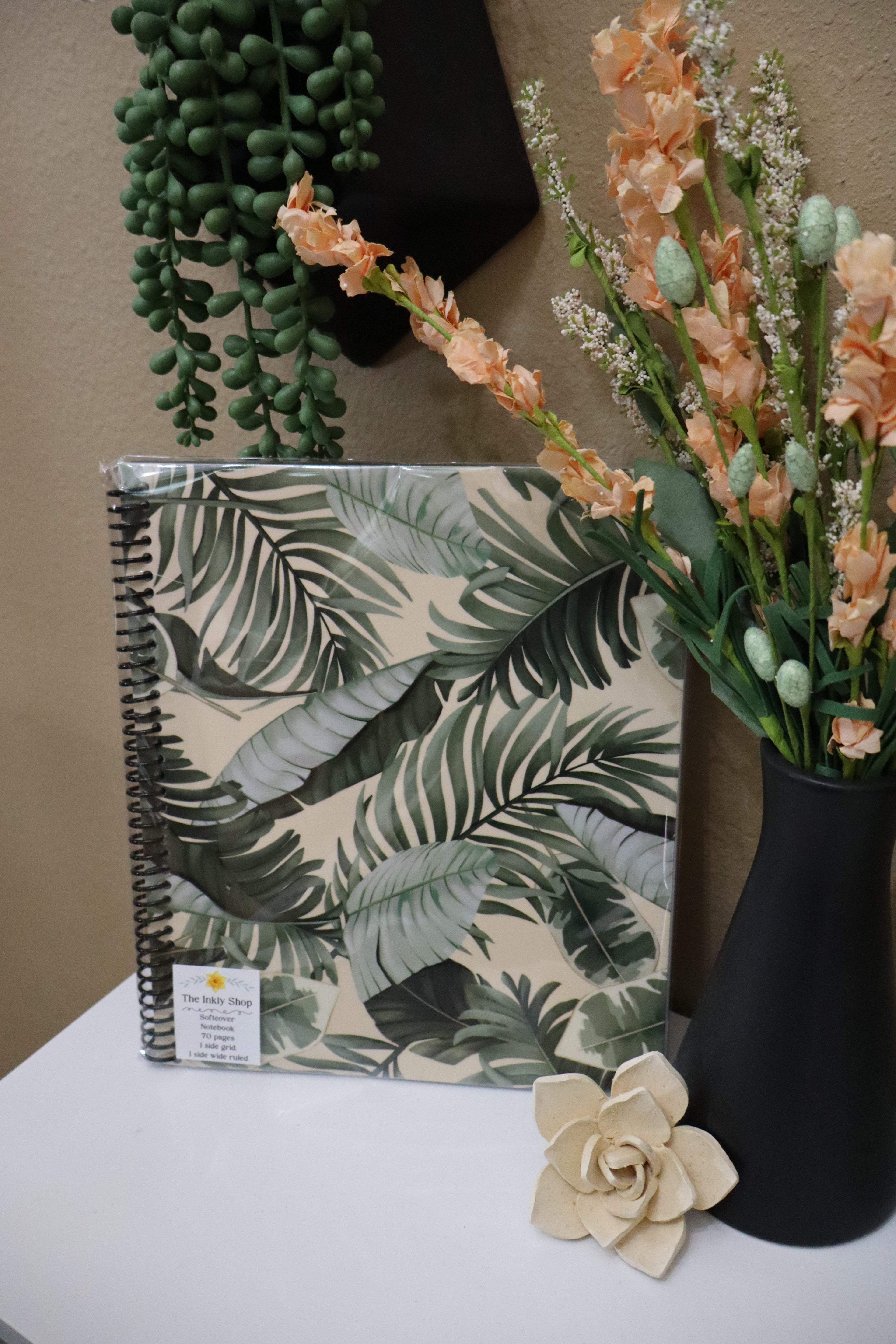 Tropical palm leaf softcover spiral notebook close-up showing lush green botanical print