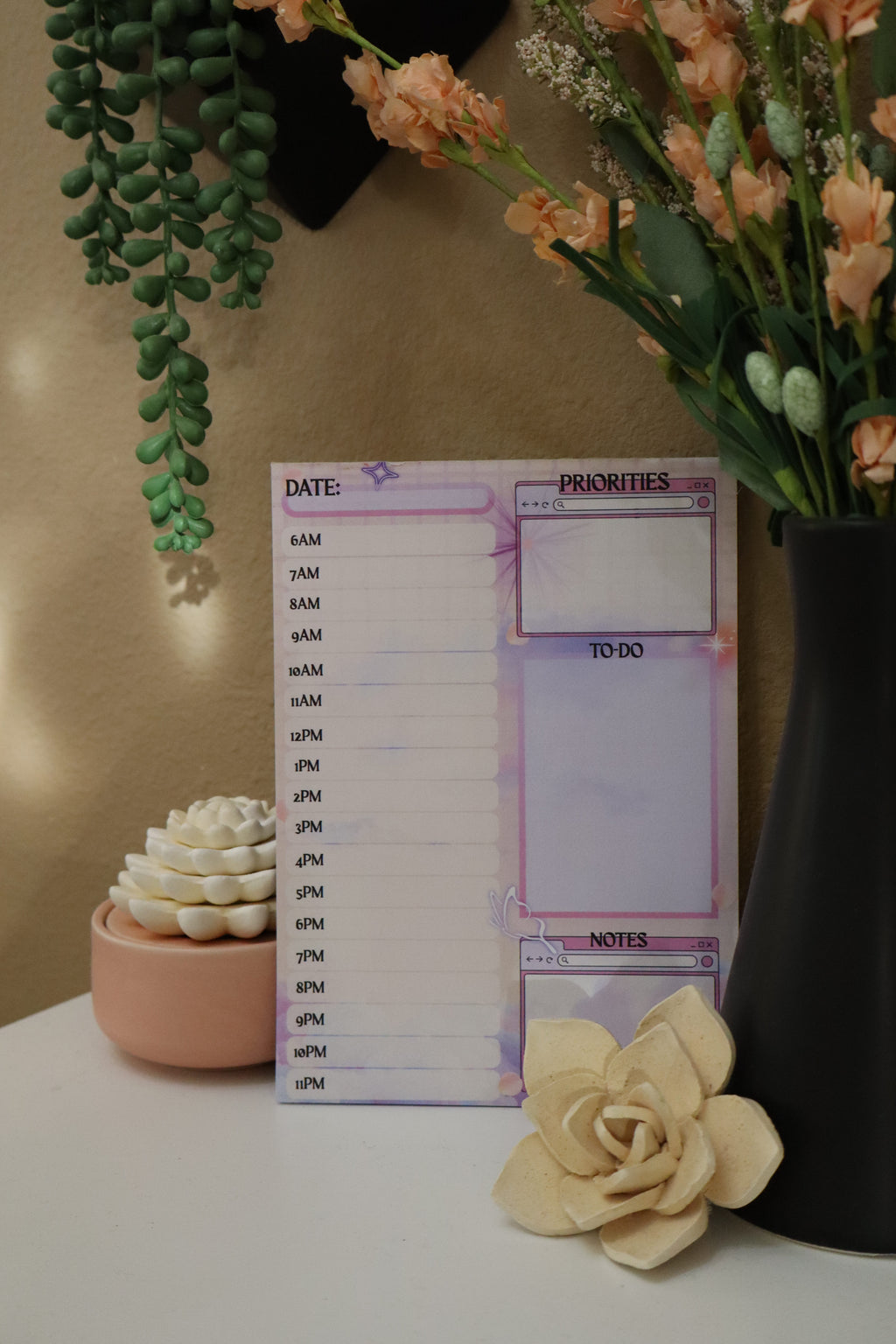 Daily planner notepad 5x7 styled on shelf with moody lighting