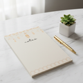 Golden lantern notepad on marble desk
